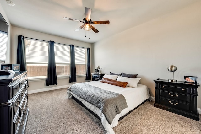 bedroom featuring ceiling fan and light carpet