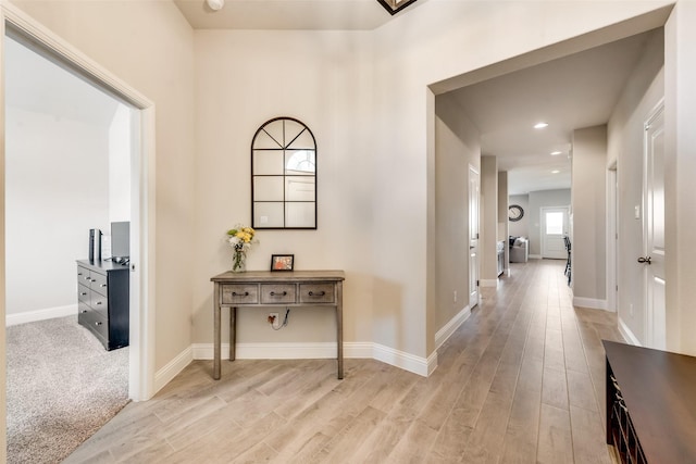 hall with light hardwood / wood-style flooring