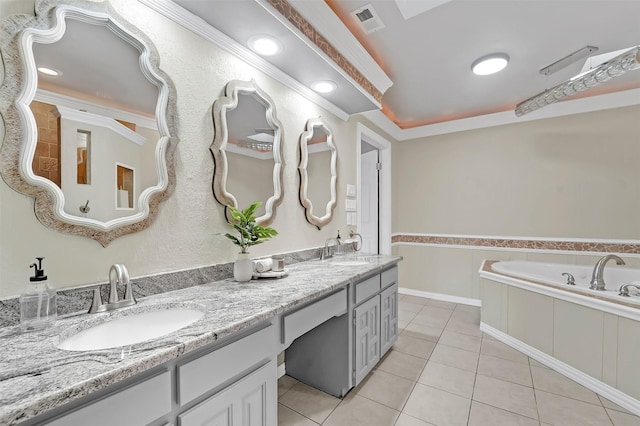 bathroom featuring crown molding, vanity, tile patterned flooring, and tiled tub