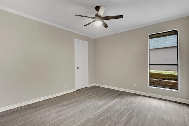 unfurnished room with crown molding, hardwood / wood-style floors, and ceiling fan