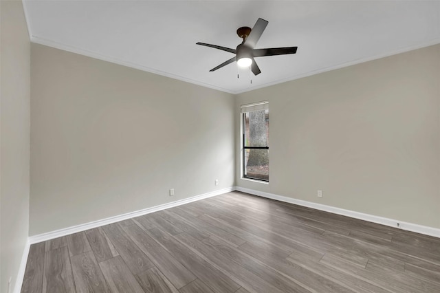 unfurnished room featuring wood-type flooring, ceiling fan, and crown molding