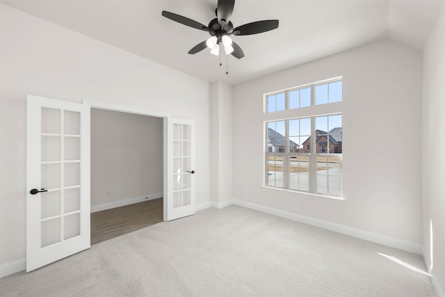 unfurnished bedroom featuring french doors, light colored carpet, and ceiling fan