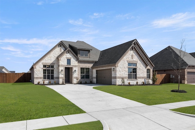 view of front of house with a garage and a front yard