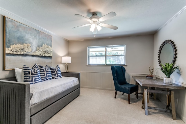 office featuring crown molding, light carpet, and ceiling fan