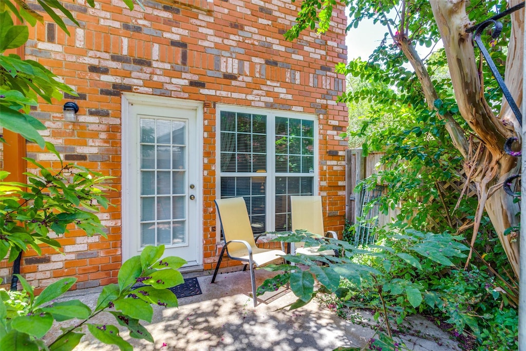 property entrance featuring a patio area