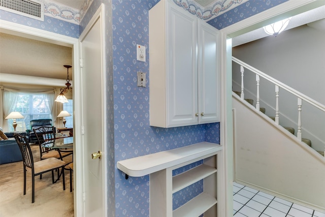 staircase with tile patterned flooring