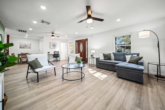 living area with a ceiling fan, recessed lighting, visible vents, and light wood-style floors