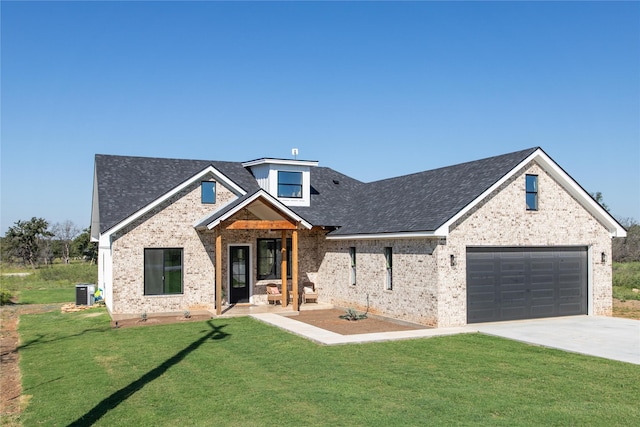 view of front facade featuring a garage, a front yard, and cooling unit