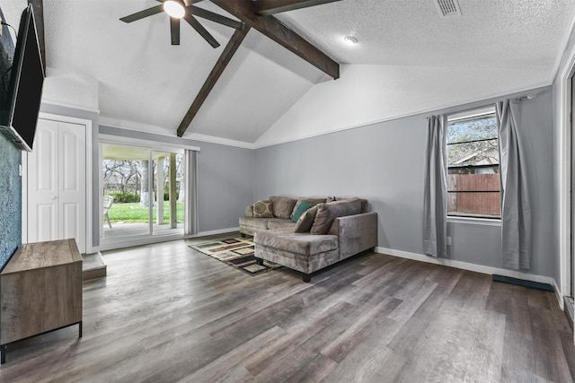 living room with ceiling fan, wood-type flooring, lofted ceiling with beams, and a textured ceiling