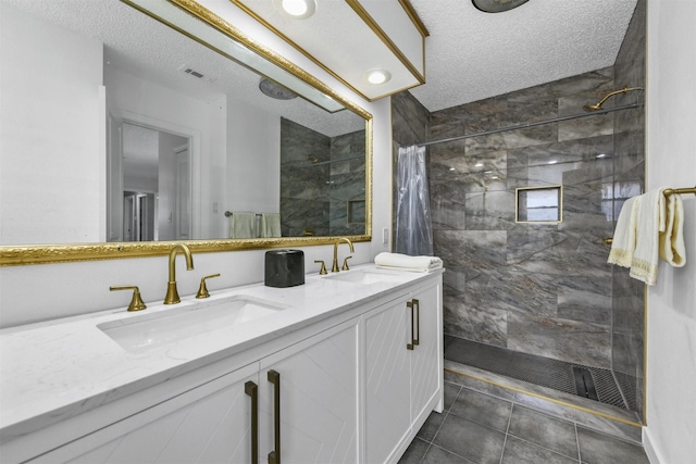 bathroom featuring vanity, a textured ceiling, and a shower with curtain