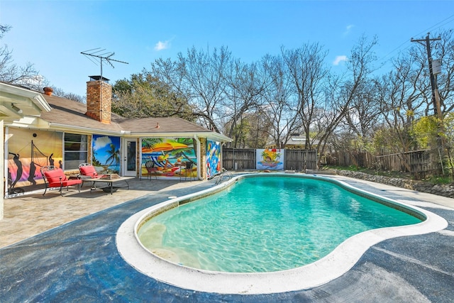 view of swimming pool with a patio