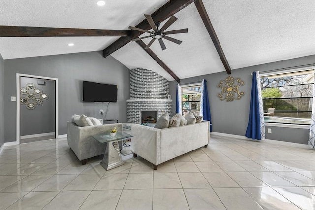 tiled living room featuring ceiling fan, a brick fireplace, lofted ceiling with beams, and a textured ceiling