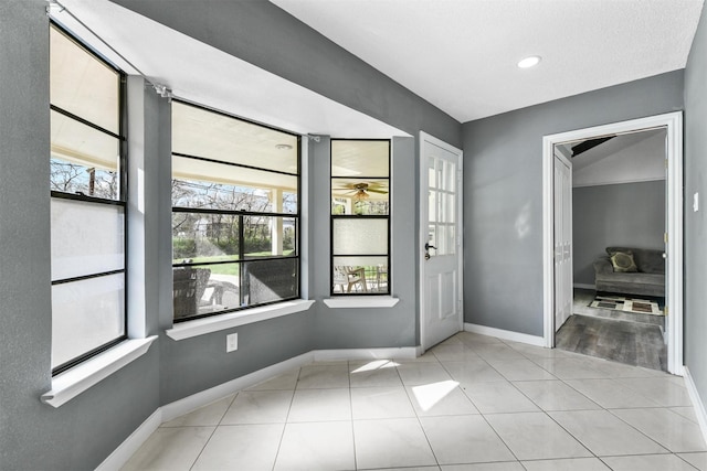 entryway with light tile patterned floors