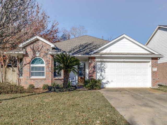 single story home featuring a garage and a front yard