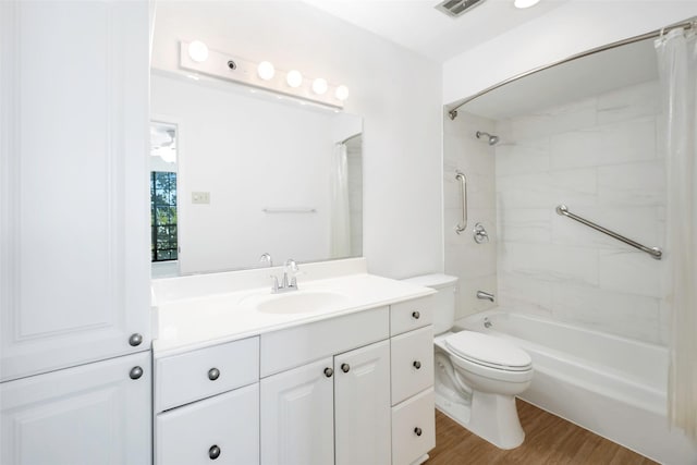 full bathroom with wood-type flooring, toilet, vanity, and shower / tub combo with curtain