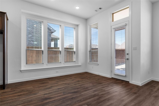 interior space with dark hardwood / wood-style floors