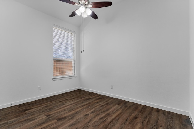 empty room with dark hardwood / wood-style flooring and ceiling fan