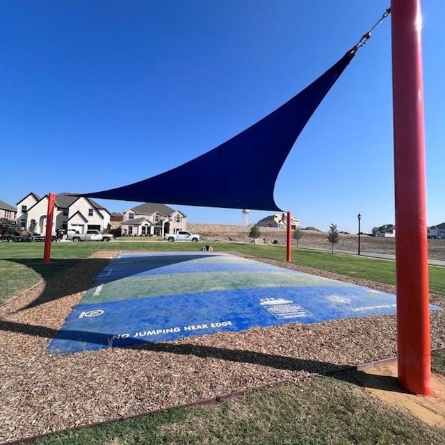 view of community featuring a lawn