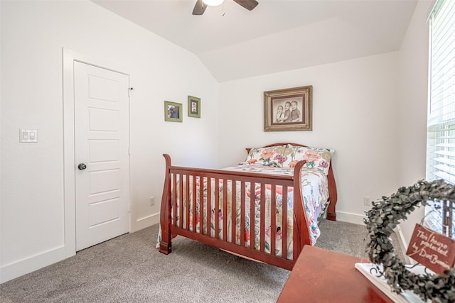 bedroom with carpet floors, ceiling fan, and vaulted ceiling