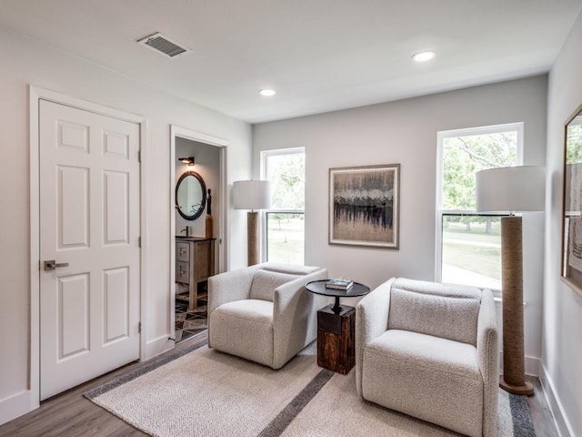 living area featuring hardwood / wood-style floors