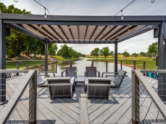 wooden deck featuring a water view