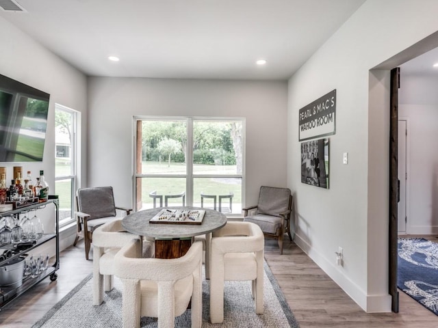 dining room with plenty of natural light and light wood-type flooring