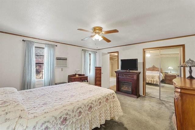 bedroom featuring ornamental molding, light carpet, a textured ceiling, and ceiling fan