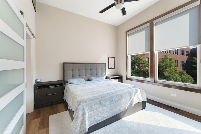 bedroom featuring dark hardwood / wood-style flooring and ceiling fan