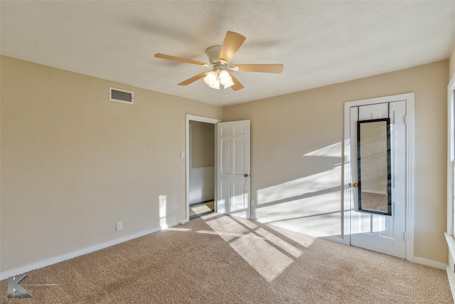 unfurnished room with ceiling fan and light colored carpet