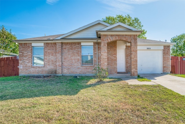 ranch-style house with a garage and a front yard