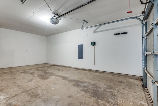 garage featuring electric panel and a garage door opener