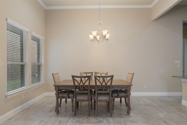 dining space featuring ornamental molding and a notable chandelier