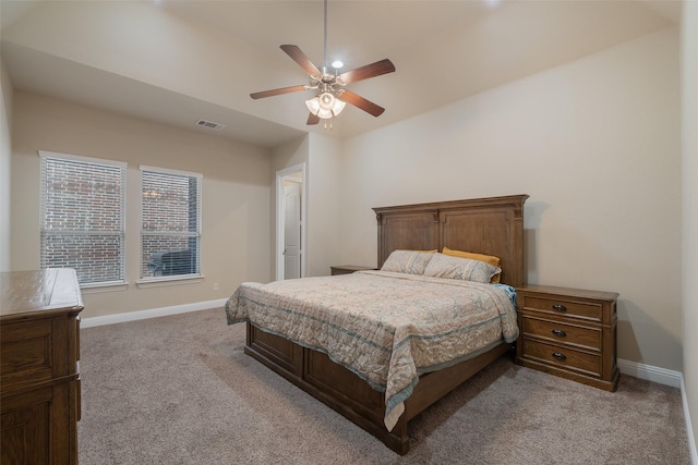 bedroom with ceiling fan and light colored carpet