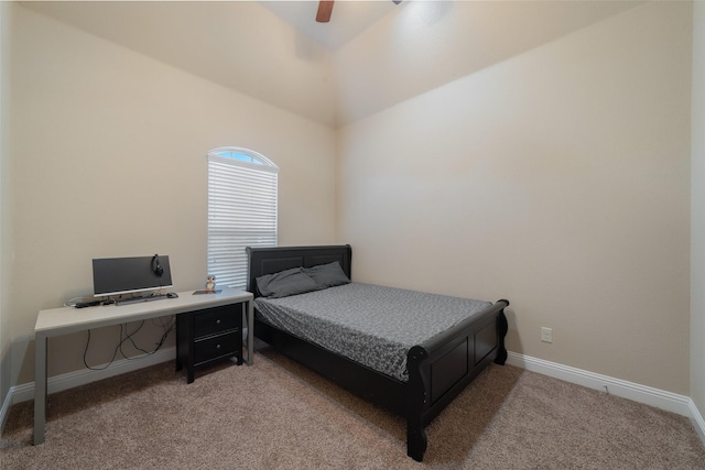 bedroom with ceiling fan, carpet flooring, and vaulted ceiling