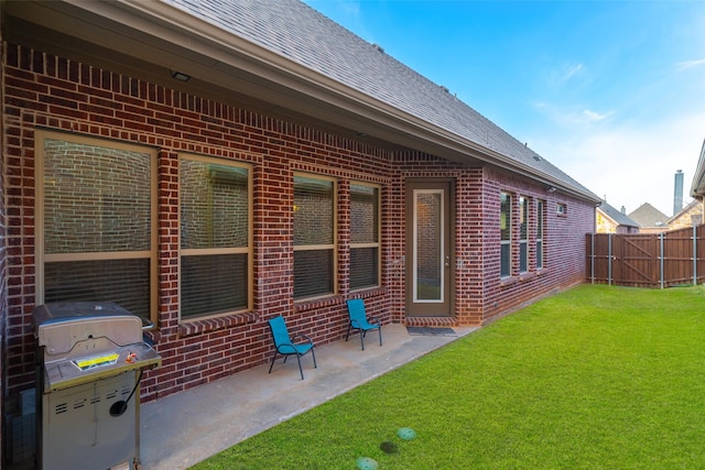 back of property with a patio and a lawn