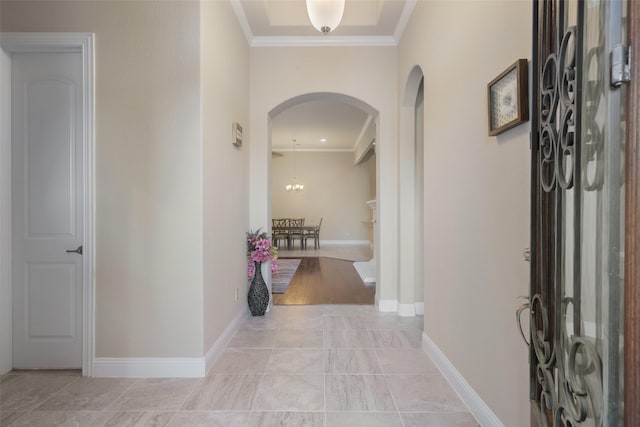 foyer entrance featuring crown molding