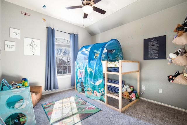 carpeted bedroom with vaulted ceiling and ceiling fan