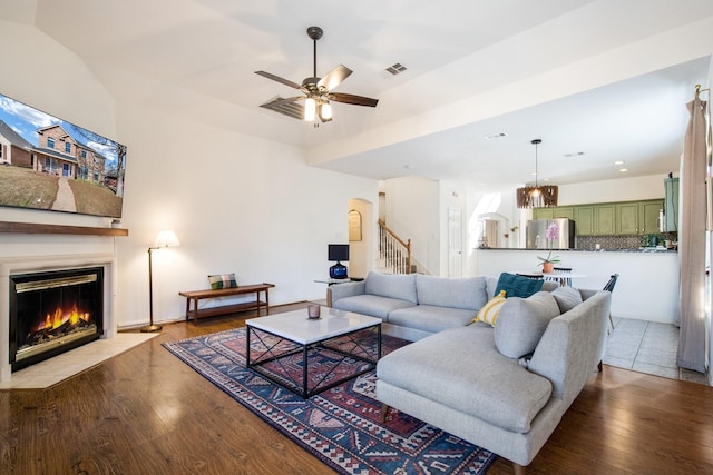 living room with hardwood / wood-style floors and ceiling fan