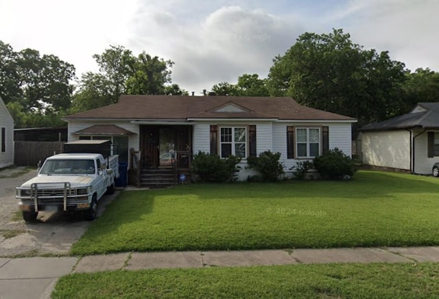 ranch-style house with a front lawn