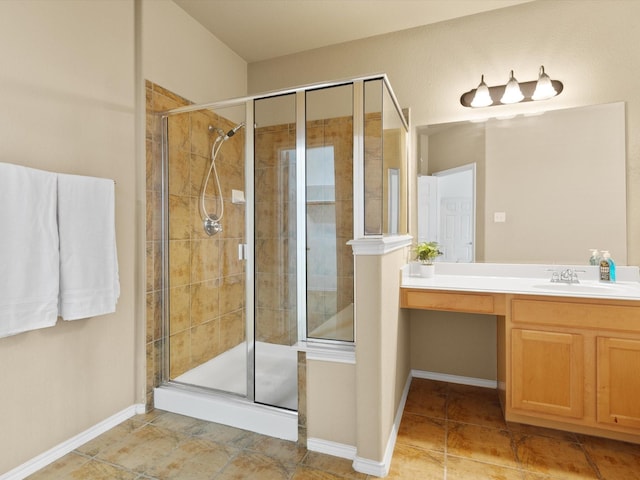 bathroom with vanity and a shower with shower door