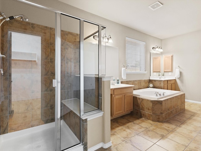 bathroom featuring tile patterned floors, vanity, and independent shower and bath