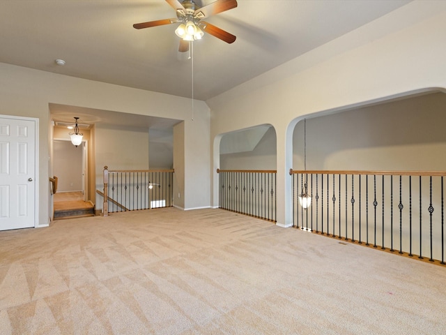 empty room with light carpet and ceiling fan