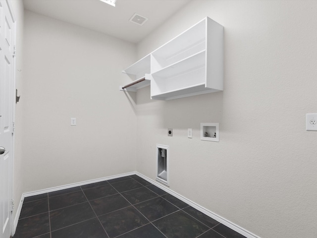 laundry area featuring hookup for a washing machine, gas dryer hookup, hookup for an electric dryer, and dark tile patterned flooring