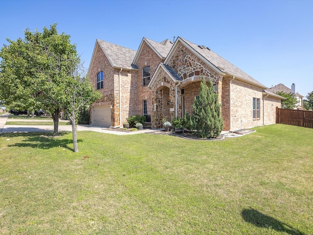 view of front of home with a garage and a front yard