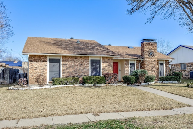 ranch-style house with a front lawn