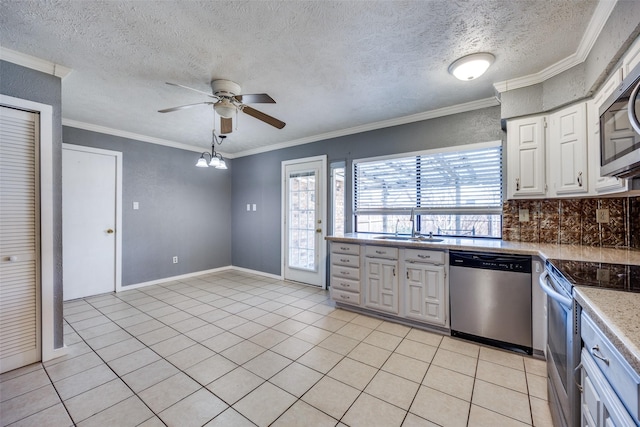 kitchen featuring appliances with stainless steel finishes, sink, and light tile patterned floors