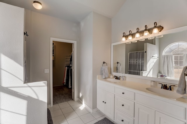 bathroom featuring vanity, curtained shower, and tile patterned flooring