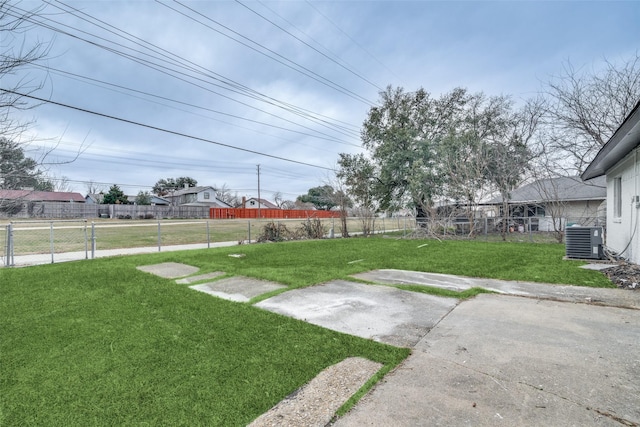 view of yard with central air condition unit