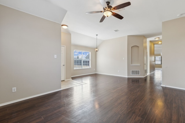 spare room featuring lofted ceiling, hardwood / wood-style floors, and ceiling fan