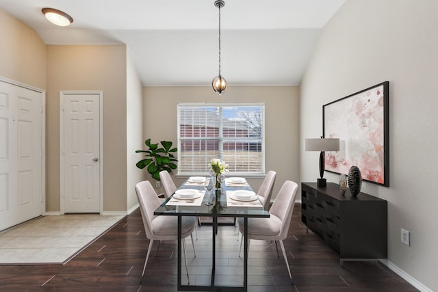 dining area featuring lofted ceiling